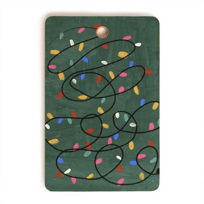 Gigi Rosado Christmas fairy lights Cutting Board Rectangle -Deny Designs