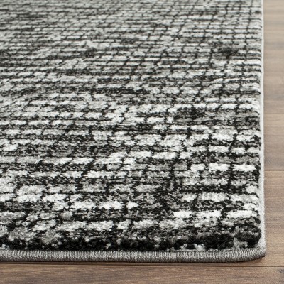 Light Grey and Charcoal Floral Synthetic Round Rug