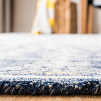 Handmade Blue and Ivory Tufted Wool Area Rug