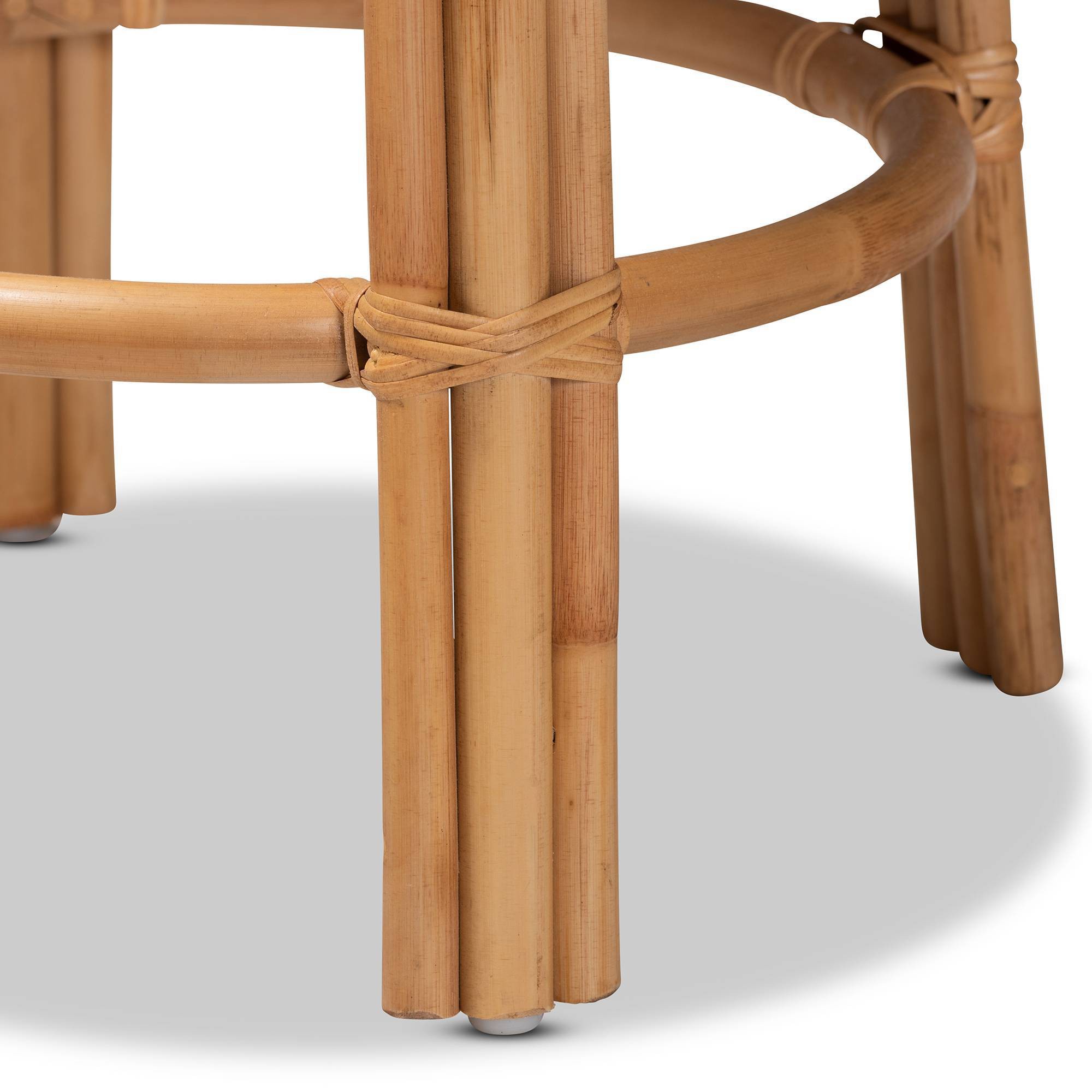 Close-up detail of the woven rattan structure on a barstool leg.