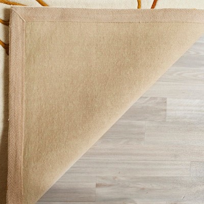 Ivory and Orange 6' x 9' Handmade Wool Tufted Area Rug