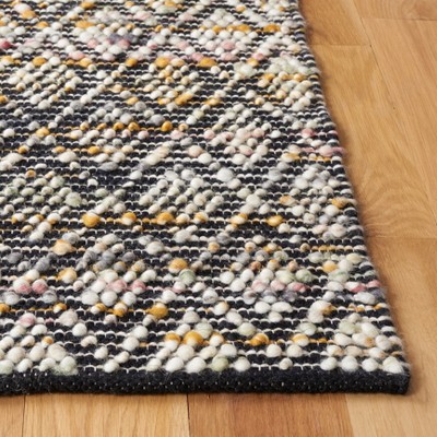 Ivory and Black Handwoven Wool Area Rug, 5' x 8'