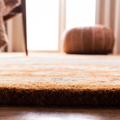 Hand-Tufted Blue and Rust Wool 5' x 8' Area Rug