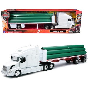 Volvo VN-780 Truck with Flatbed Trailer and Long Pipes White "Long Haul Truckers" Series 1/32 Diecast Model by New Ray - 1 of 4