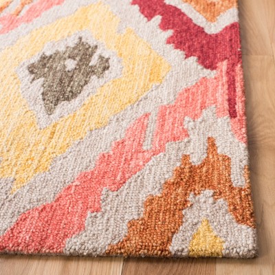 Handmade Red Ikat Wool Tufted Area Rug