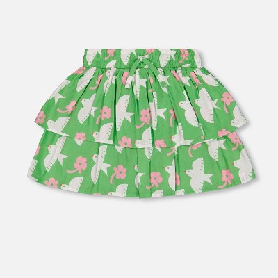 green with white and pink bird