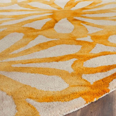 Handmade Round Beige and Gold Wool Area Rug
