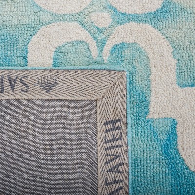 Turquoise and Ivory Handmade Tufted Wool Rectangular Rug - 2' x 3'