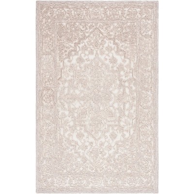 Ivory and Natural 4' x 6' Hand Tufted Wool Area Rug