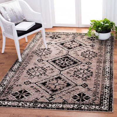 Elegant Antique Patina 5' x 7' Black Synthetic Area Rug