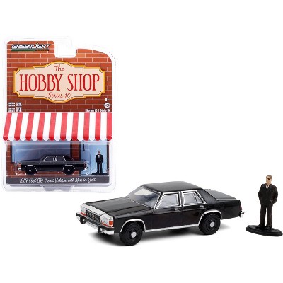 1987 Ford LTD Crown Victoria Black with Man in Black Suit Figurine "The Hobby Shop" Series 1/64 Diecast Model Car by Greenlight