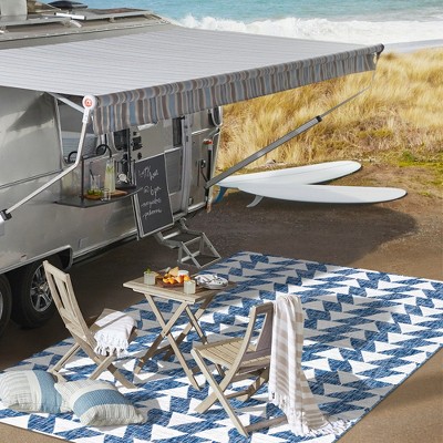 Ivory and Blue Geometric 4' x 6' Synthetic Area Rug