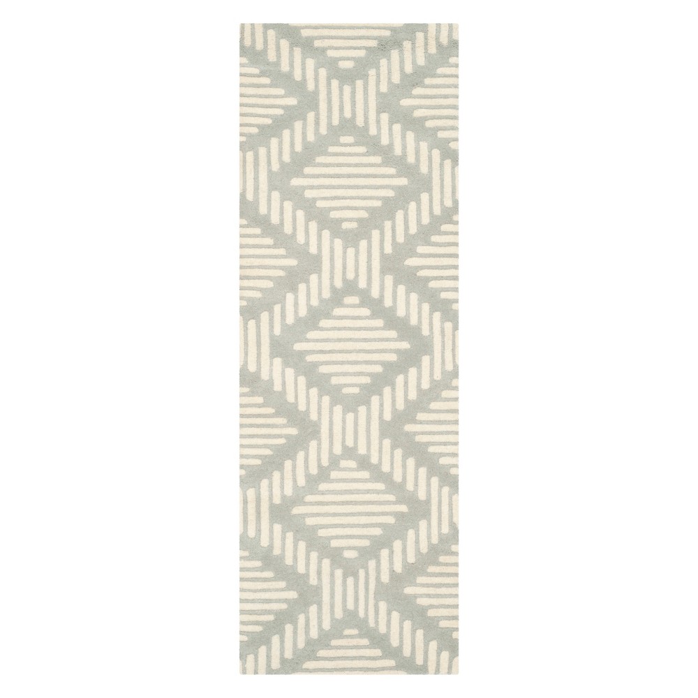 2'3inx7' Becky Geometric Tufted Accent Rug Gray/Ivory - Safavieh