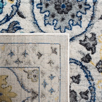 Ivory and Blue Reversible Synthetic Area Rug, 6'7" x 9'
