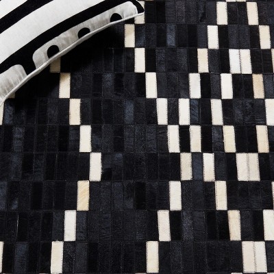 Black and Beige Handmade Geometric Cowhide Area Rug