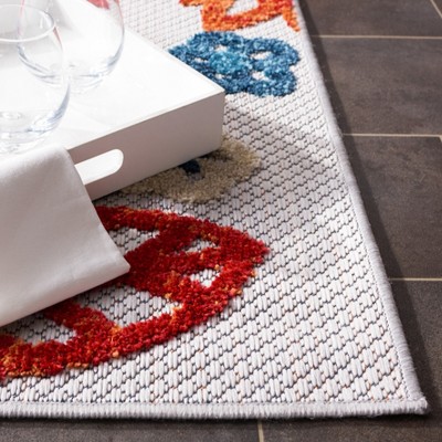 Cream and Red Floral 2' x 4' Synthetic Indoor/Outdoor Rug