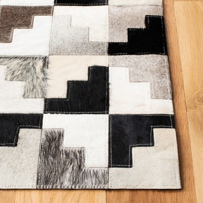 Ivory and Black Geometric Cowhide Patchwork Area Rug 8' x 10'