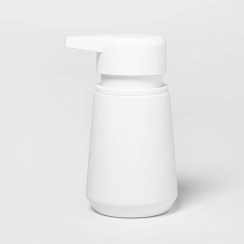 White soap dispenser deals pump