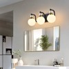 PAKOKULA 3-Light Black and Gold Vanity Light with Globe White Frosted Glass Shade - 3 of 4