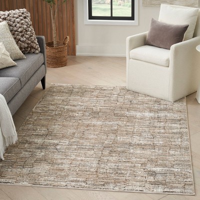 Ivory and Tan Abstract Synthetic Rectangular Rug 5' x 7'