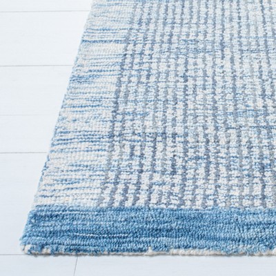 Ivory and Blue Hand-Tufted Wool 4' x 6' Area Rug
