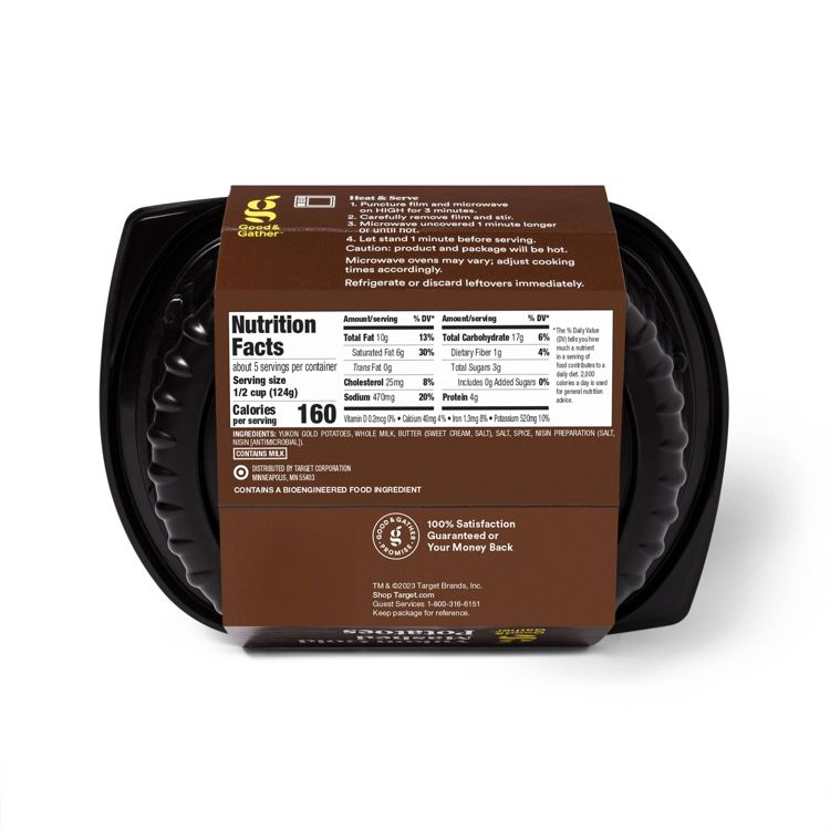 Black plastic container with a brown label showing nutrition facts for mashed potatoes, including 160 calories per serving and ingredients like Yukon Gold potatoes, whole milk, and butter.