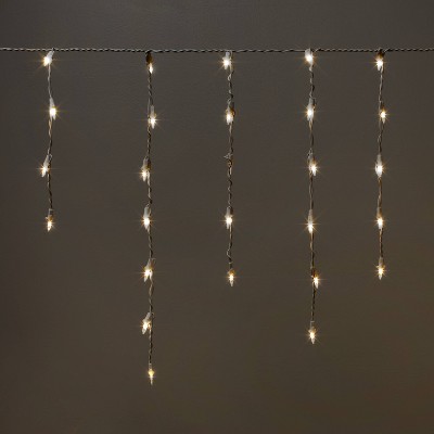 8.5' 105ct LED Icicle Lights Warm White with White Wire - Wondershop™