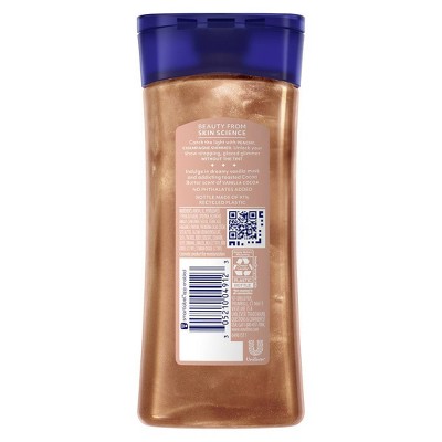 A plain shot of the back of Caress Body Wash. The bottle is bronze with a navy cap. Key claims: 