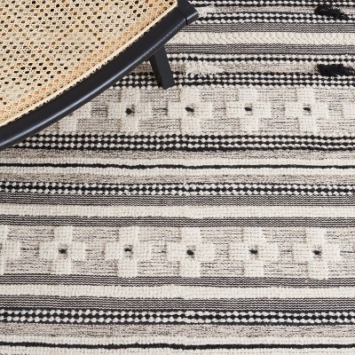 Handmade Black and Ivory Wool Flat Woven Area Rug