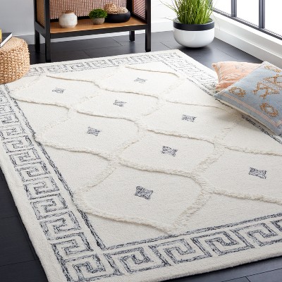 Ivory and Black 5' x 8' Hand Tufted Wool Shag Rug