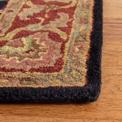 Hand-Tufted Oval Navy and Red Wool Accent Rug