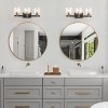 Dewdrop 3-Light Bathroom Vanity Light, Modern Black and Gold Wall Sconce with Ribbed Clear Glass Shades - 4 of 4