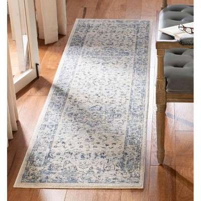 Ivory and Navy Synthetic 2' x 6' Runner Rug