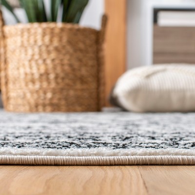 8' x 10' Black and Ivory Geometric Synthetic Area Rug
