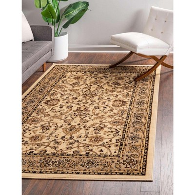 Ivory and Tan 4' x 6' Stain-Resistant Synthetic Area Rug