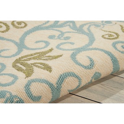 Ivory and Blue Floral Synthetic 9'3" x 12'9" Round Area Rug