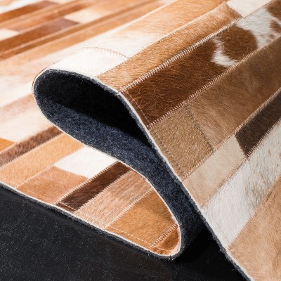 Handwoven Tan and Ivory Geometric Cowhide Area Rug