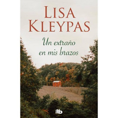 Un Extraño En MIS Brazos / Stranger in My Arms - by  Lisa Kleypas (Paperback)