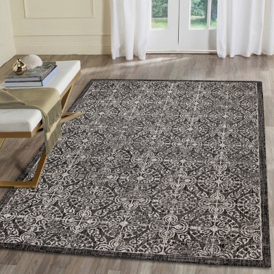 Antique Medallion Tile Black Synthetic 6'6" x 9'3" Area Rug