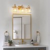 DORESshop 23 in. Gold 3-Light Bathroom Vanity Light with Ribbed Bottle Glass Bathroom Wall Sconce for Corridor and Hallway - 3 of 4