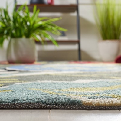 Handmade Black Floral Rectangular Synthetic Area Rug
