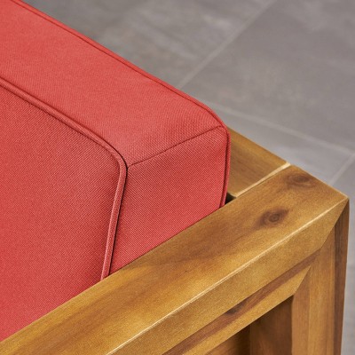 Teak Brown Lounge Chair with Plush Red Cushions