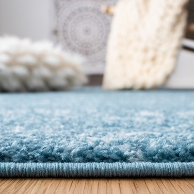 Turquoise and Blue Synthetic 4' x 6' Reversible Area Rug