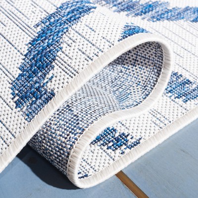 Ivory and Navy Animal Print Indoor/Outdoor Rug