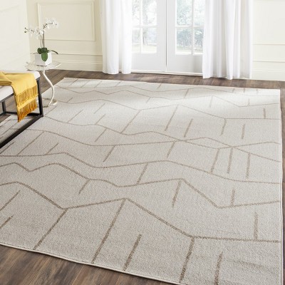 Ivory Geometric Easy-Care 8' x 10' Synthetic Area Rug
