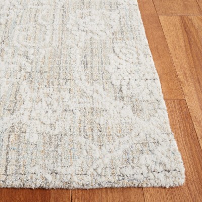 Ivory Tufted Wool 4' x 6' Rectangular Area Rug