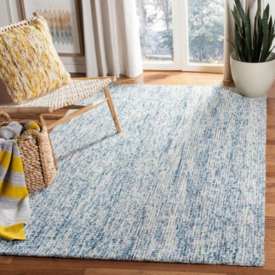 Ivory and Navy Abstract Wool 4' x 6' Area Rug