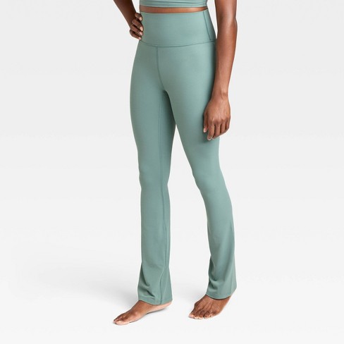new XERSION women's L Fitted Leggings Yoga Pants Black Lime Green Leg Zip  pocket