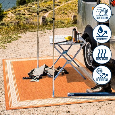 Lucia Cream and Orange Synthetic Indoor/Outdoor Area Rug