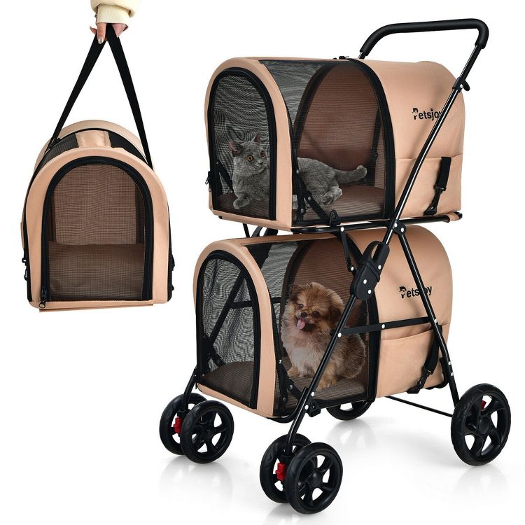 Beige colored pet stroller with two mesh compartments, each containing a pet, and a matching detachable carrier held by a hand.